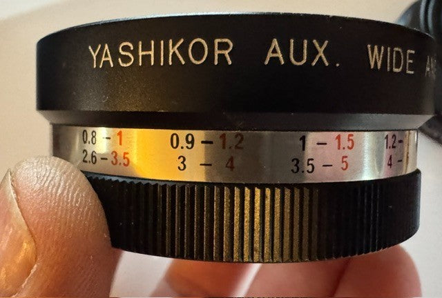 Two Yashica lenses in case