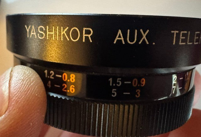 Two Yashica lenses in case