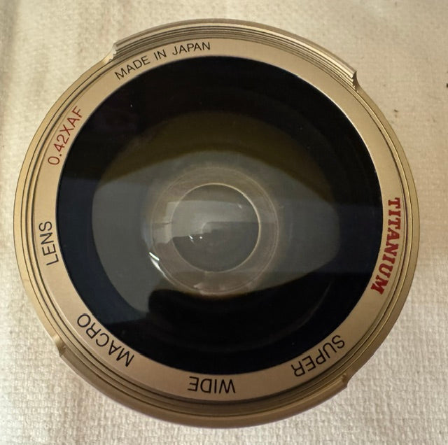 Titanium Super Wide Angle 0.42x AF Lens — Leather Case, Two Adapter Rings, Original Box & Instructions