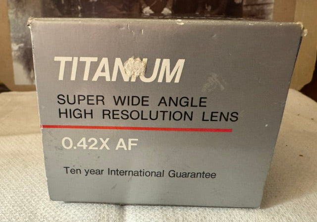 Titanium Super Wide Angle 0.42x AF Lens — Leather Case, Two Adapter Rings, Original Box & Instructions