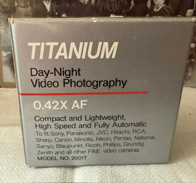 Titanium Super Wide Angle 0.42x AF Lens — Leather Case, Two Adapter Rings, Original Box & Instructions