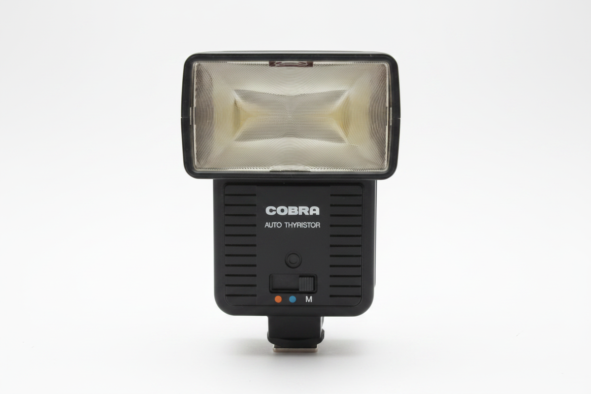 Cobra Auto Thyristor flash on white background