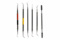 Five vintage dental tools - white background